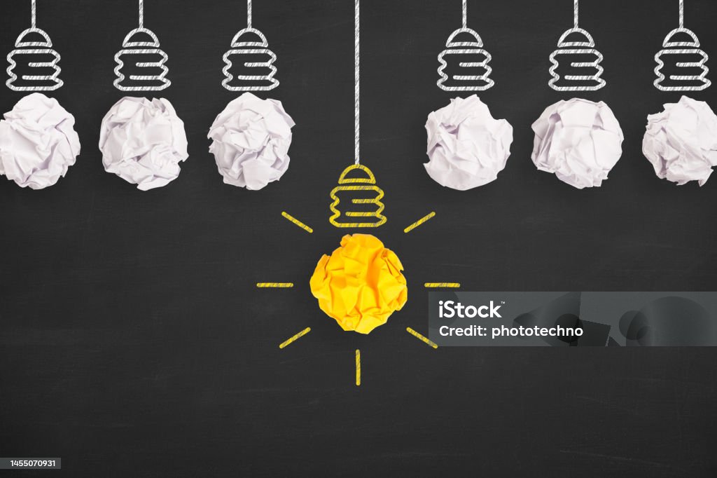 Idea Solution Concepts Light Bulb Crumpled Paper on Blackboard Background Leadership Stock Photo