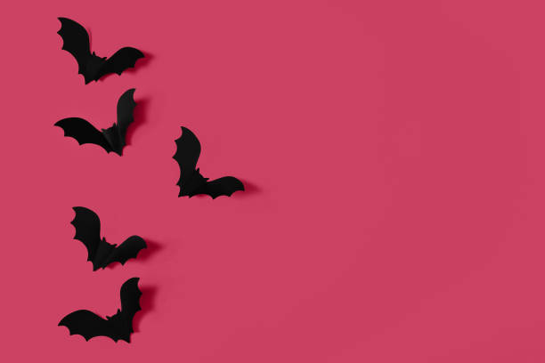 cartoon halloween hintergrund schwarze fledermäuse auf trendigem magenta-hintergrund. - fledermaus grafiken stock-fotos und bilder