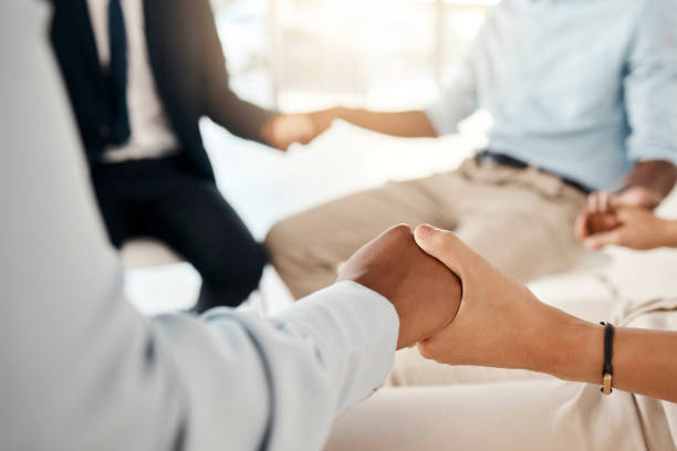 istock Support, community and business people holding hands in a meeting for communication, collaboration and team building. Corporate, conference and workers praying, planning and working as a team 1455072003