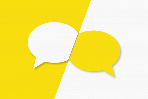 Blank Speech Bubbles with Copy Space On Yellow Cardboard Background