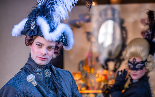 Venice, Italy - February 8, 2015: People masquerading at the famous carnival parade.