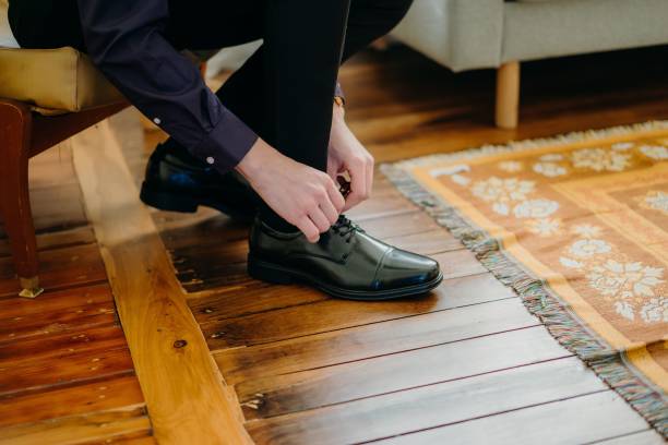 istock Businessman wearing elegant shoes 1455073534