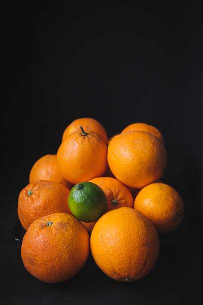 A lemon among oranges. Organic citrus. Individual, different and community concept