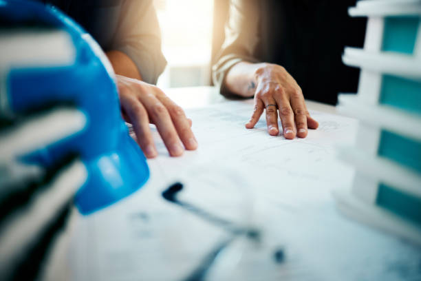 istock Blueprint, hands and business for discussion for building plans, construction and collaboration for work. Teamwork, engineer partners and architect talking, planning and have conversation for project 1455075370