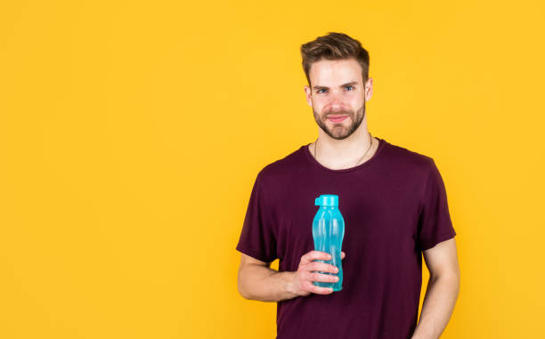 istock Hydrate copy space. man drink water after active training. handsome guy hold water bottle. hydration and hydro-balance. sport and health. refreshing while fitness. water balance in body. healthcare 1455076831