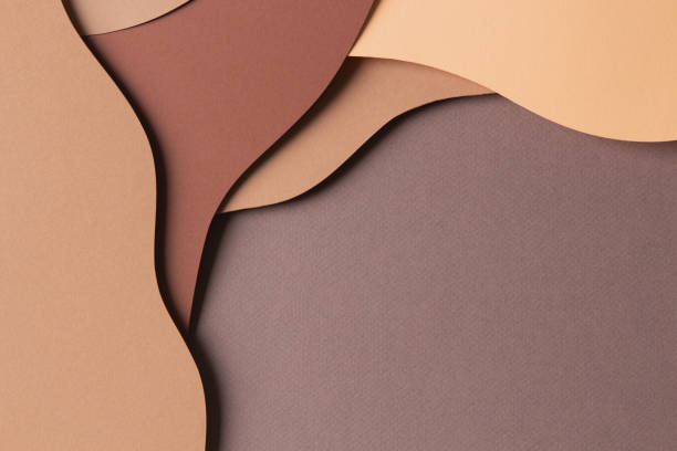 istock Abstract colored paper texture background. Minimal paper cut style composition with layers of geometric shapes and lines in shades of beige and brown colors. Top view 1455077081