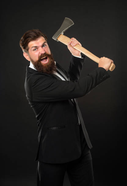 istock Aggressive bearded man in suit threaten with axe dark background, rage 1455077934