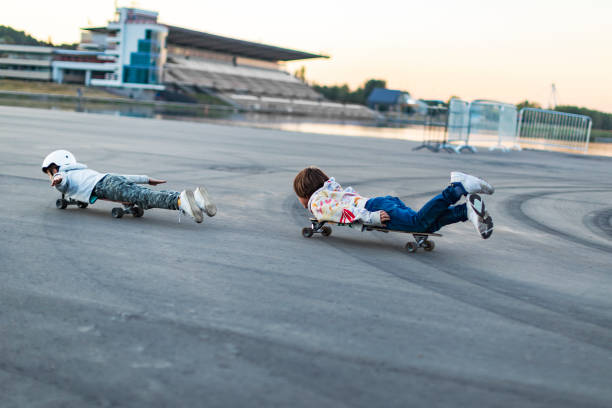 istock School age brothers skateboarding in park 1455078618