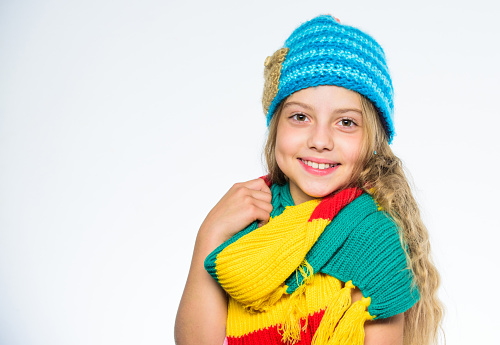 Be bright this autumn. Girl long hair happy face wear bright knitted hat and scarf white background. How to style colourful accessory for autumn. Bright accessories for soft autumn. Bright accessory.