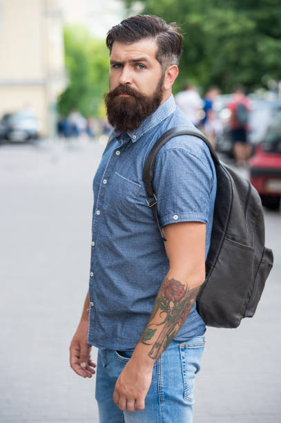 istock bearded man with backpack. man with beard. brutal man outdoor 1455080177