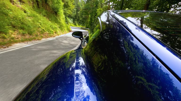 Sports car speeds down the scenic rural road