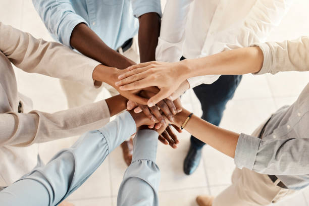 istock Hands, team with support and solidarity, diversity with business people, collaboration and trust in the workplace. Community, team building and working together, office teamwork and partnership. 1455081662