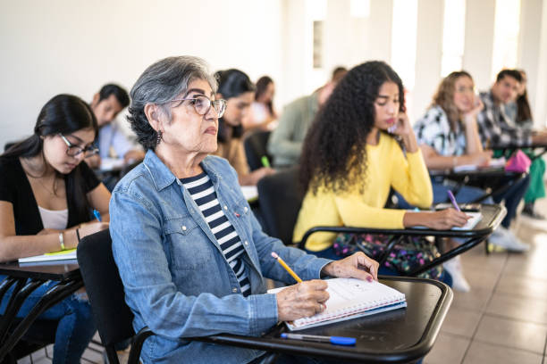 istock Senior woman watching class at university 1455082312