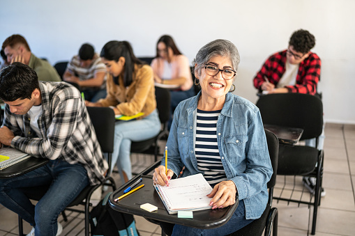 Portrait of a senior woman studying in the classroom at university