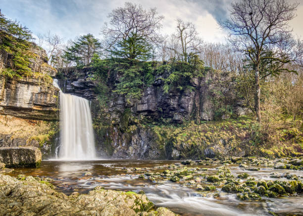 istock Beautiful view of a waterfall on a mountain in a daylight 1455084882