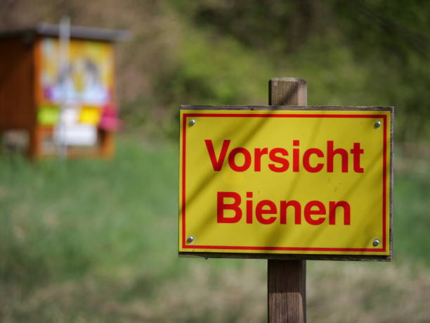 istock a sign warning of a beehive 1455085022
