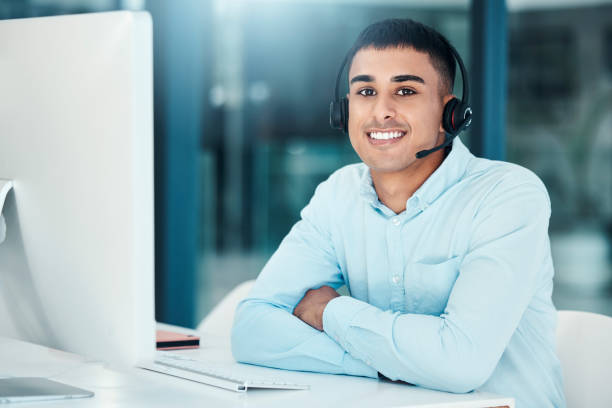 istock Call center, portrait and employee with a smile and computer for support, help and communication on the internet. Crm, ecommerce and telemarketing worker working in customer service as a consultant 1455085197