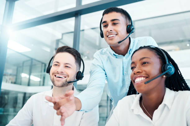istock Call center, manager and new employees training, coaching and advice for customer service, work process and smile in office. Team leader, coach and teaching junior consultants telemarketing system. 1455087776