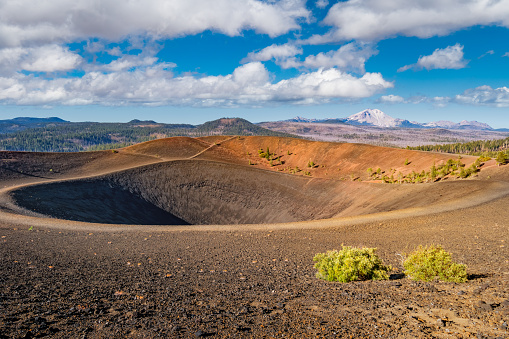 Landscape with the Cinder Cone Rim in Lassen Volcanic National Park with Lassen Peak in the distance, California, USA.