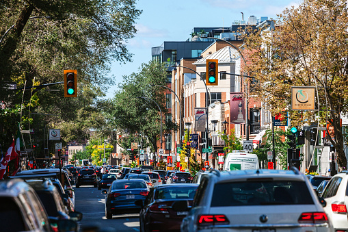 Montreal, Canada - Saint Laurent street traffic and crowd in Little Italy district