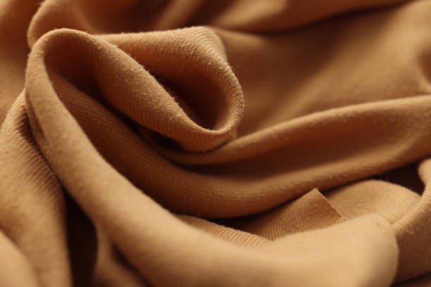 istock Wrinkled bright orange knitted fabric for the background 1455091381