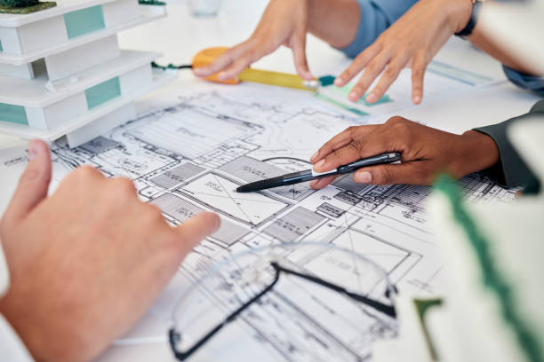 istock Architect, hands and blueprint for building collaboration, planning new project and discussion. Engineer, teamwork and talking for construction, architecture design or brainstorming creative strategy 1455095675