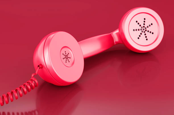 istock Handset, telephone receiver in trending viva magenta colors, 3D rendering 1455096777
