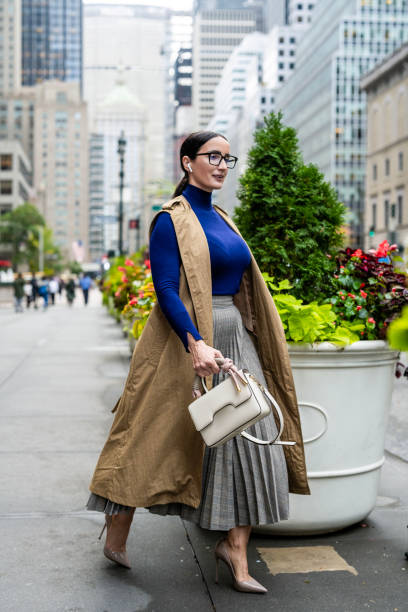 istock Nicely dressed businesswoman seen exiting the building in Manhattan after work 1455097025