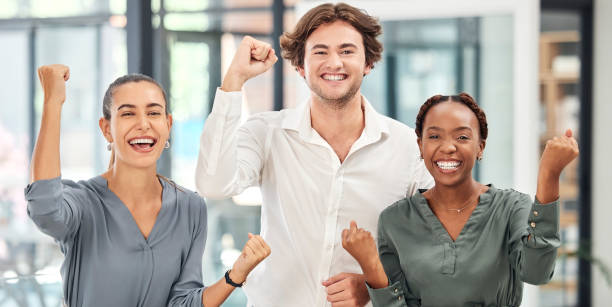 istock Teamwork, diversity and celebration with business people excited and happy about target, success or profit from growth of project. Diversity team of women and man celebrate good service reward 1455097227