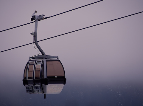 Cable car over Alpine overcast