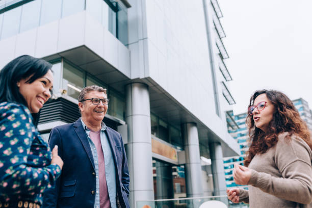 istock Coworkers chatting after work outdoors 1455098675