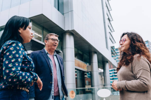 istock Coworkers chatting after work outdoors 1455098680