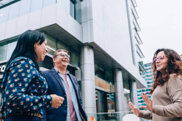 istock Coworkers chatting after work outdoors 1455098681