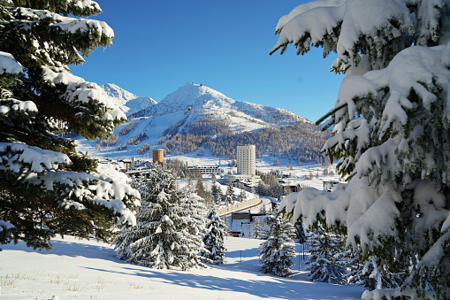 Overview of the snow-covered alpine village of Sestriere, which was the site of the Winter Olympics in 2006. Sestriere, Piedmont, Italy
