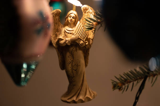 Decoration and bubbles is hanging on green christmas tree.  Cracov in Poland.