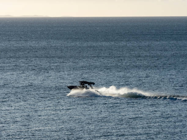 istock Speed boat in water leaving wake 1455105834