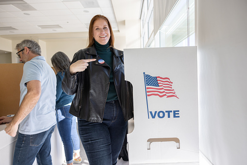 A woman voting at a local community center.