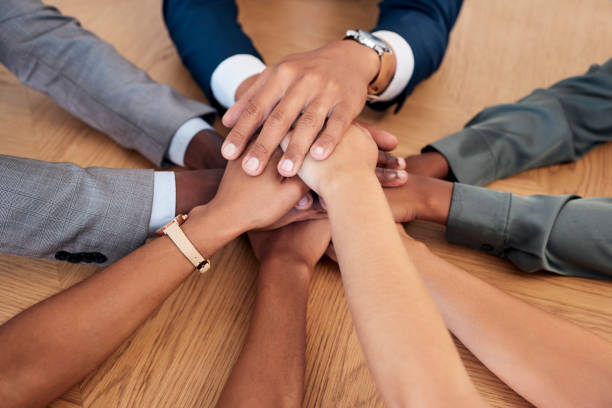 istock Support, partnership and hands of diversity business people stack together in solidarity, trust and teamwork collaboration. Community, team building meeting and company group  united for mission goal 1455108311