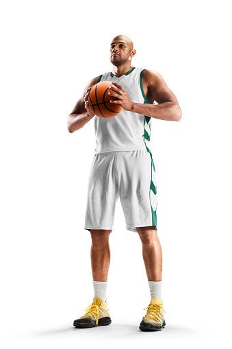 Basketball player holding the ball. Professional basketball player standing in white background