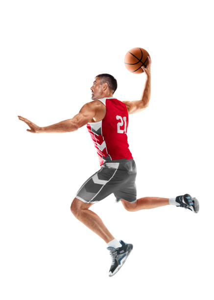 баскетболист в прыжке. баскетболист в движении и действии. спортивная энергия. спортивные эмоции. изолированный - athlete muscular build basketball vertical стоковые фото и изображения
