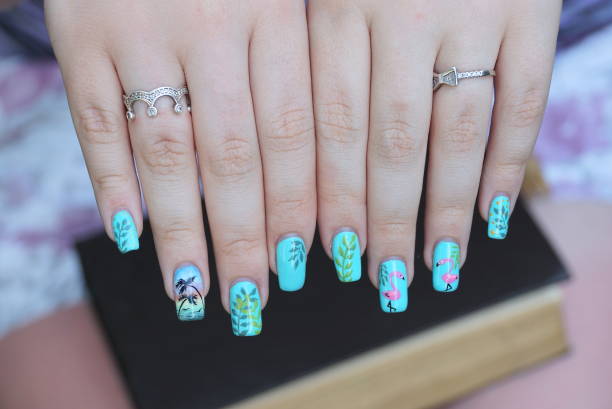 istock blue colored manicure on the nails of white fingers 1455110004