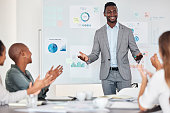 Chart presentation, leader or team applause for achievement of kpi goals, financial target or sales growth. Marketing feedback data, black man and people clap for strategy success at business meeting