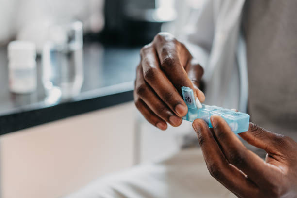 istock Man medicating himself at home medicine 1455111134