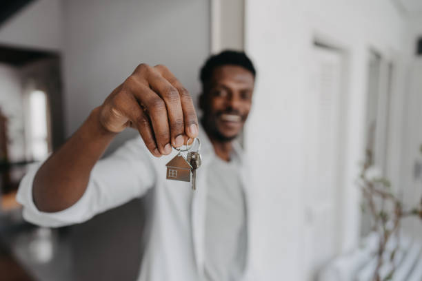 Man holding new house key stock photo