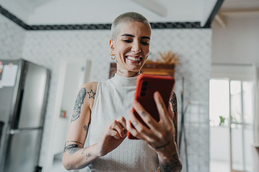 Woman using smartphone at home