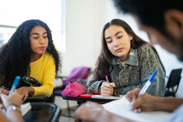 istock Young friends studying in the classroom at university 1455111405