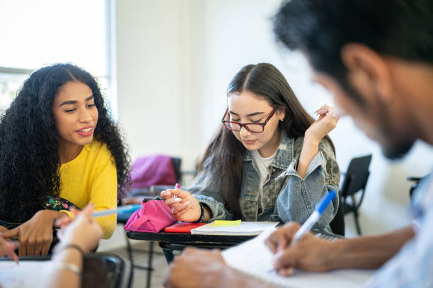 istock Young friends studying in the classroom at university 1455111411