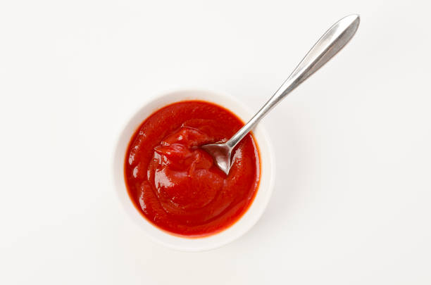 istock Tomato Ketchup in a white bowl on a white background 1455111593