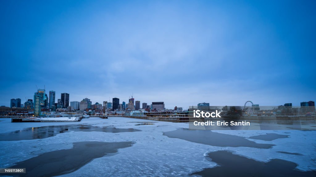 Montreal, view of the skyscrapers in winter from the old port and the St. Lawrence River Blue Stock Photo