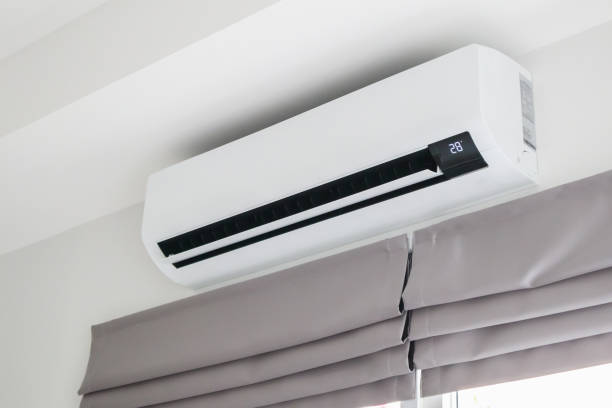 istock Air conditioner on white wall room interior background 1455118358